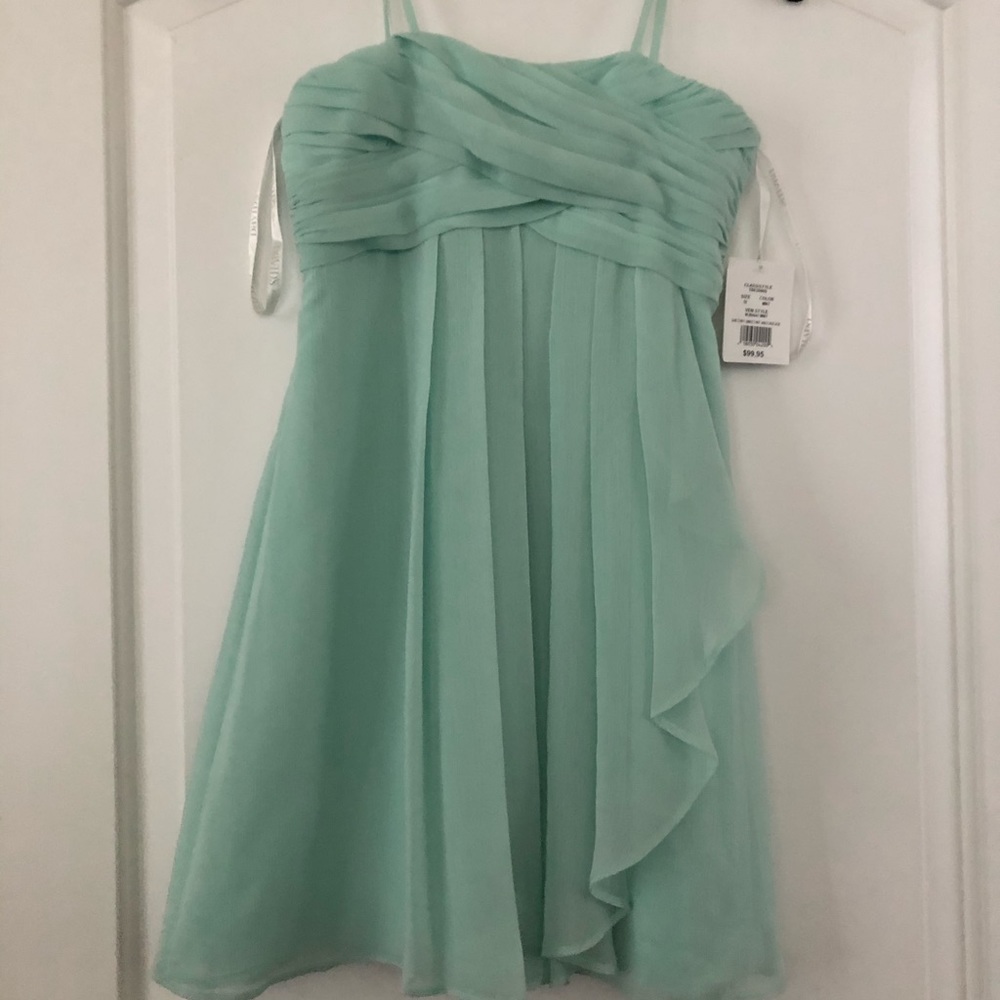 Mint green junior bridesmaid dress.